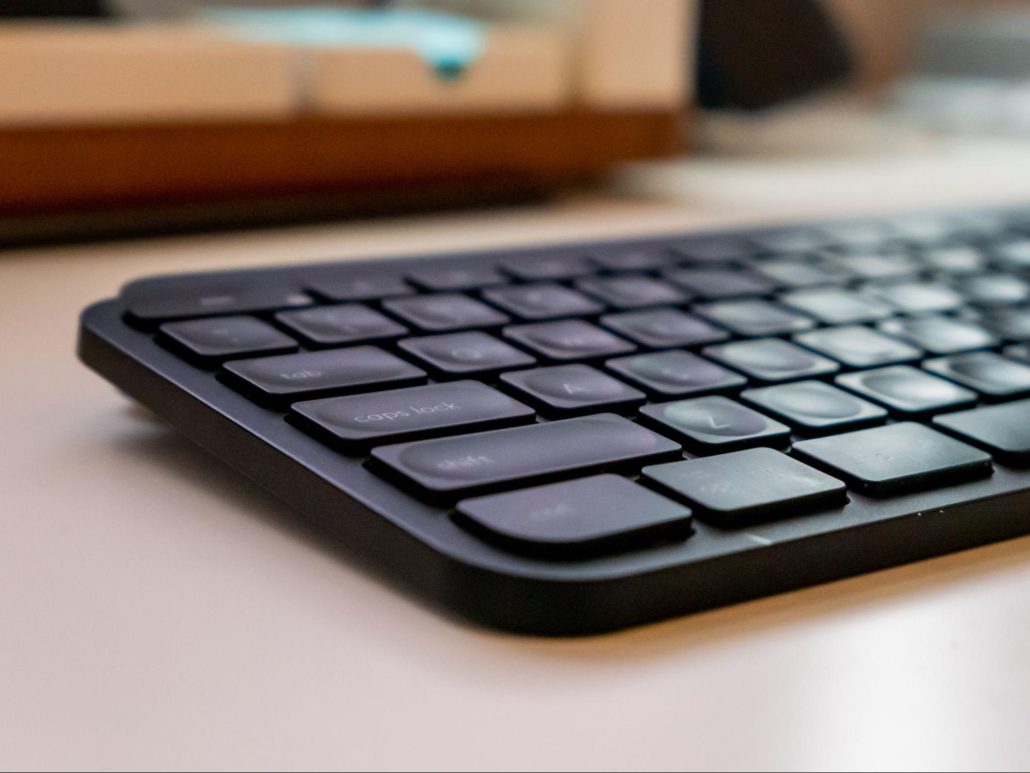 A black keyboard resting on a desk